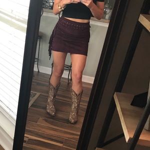 Garnet mini skirt. Faux suade with fringe